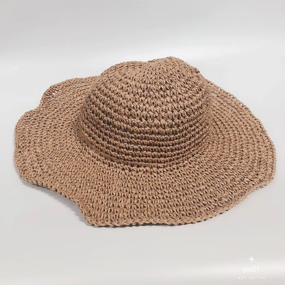 Women's foldable straw sun hat with wide brim for summer sun protection
