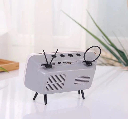 Vintage-inspired portable Bluetooth speaker with retro TV design, available in various colors including blue, orange, silver gray, and coffee