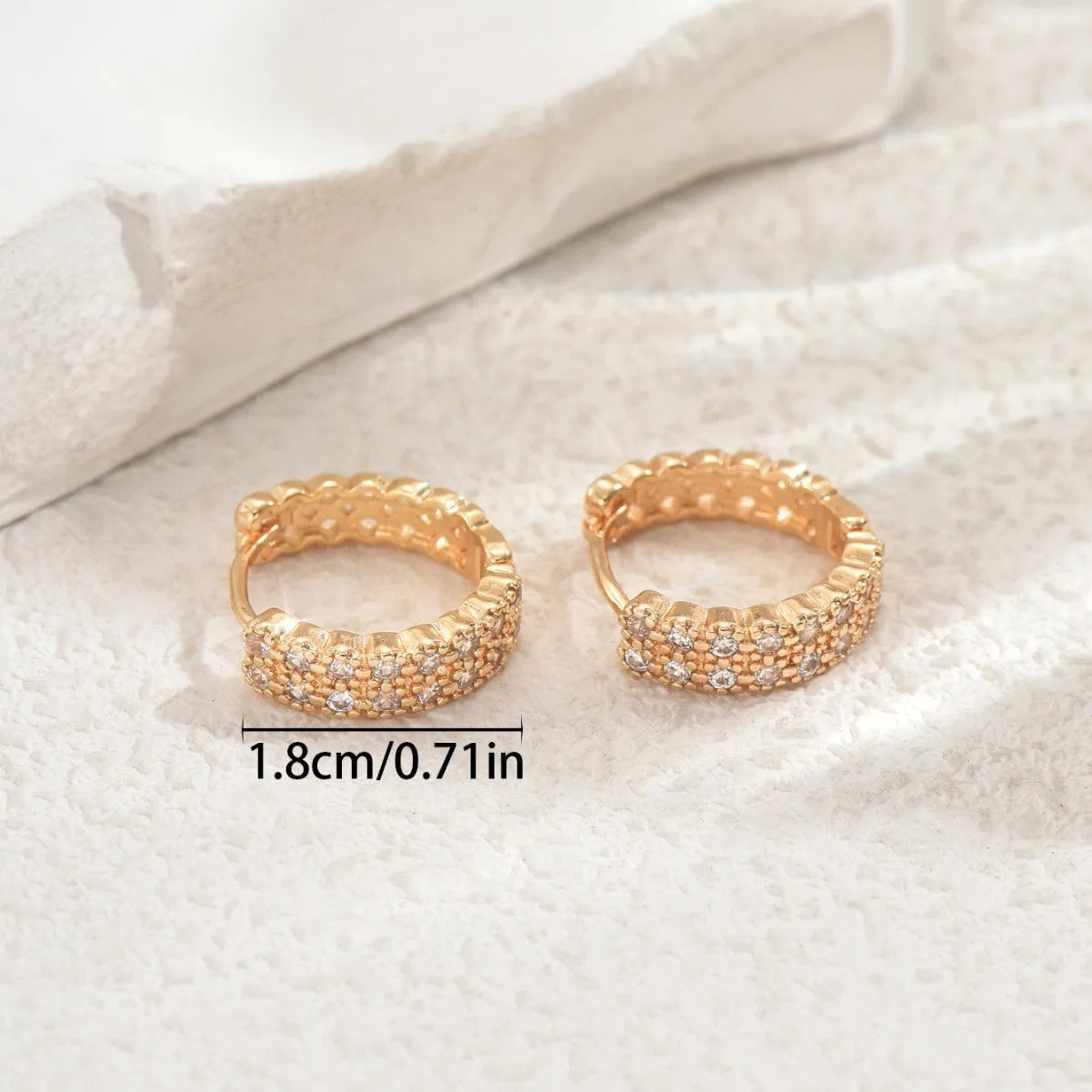 Copper geometry pattern ear studs with round, dot, and ring elements.