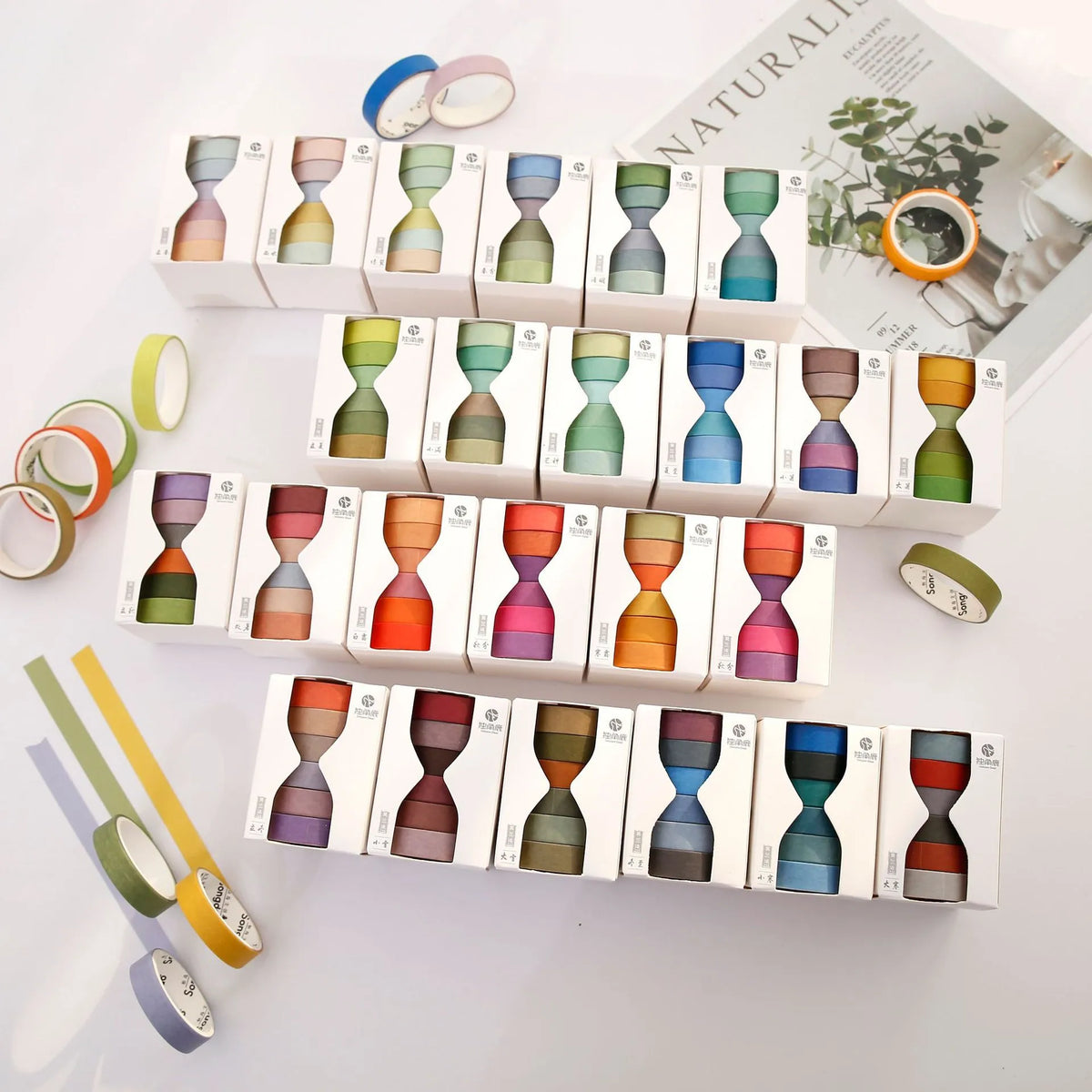 Morandi Japanese paper tape six rolls 9mm x 3m in assorted colours on craft background
