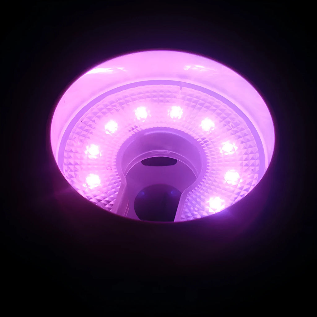 LED ball hole light with transparent shell and screwdriver on golf hole