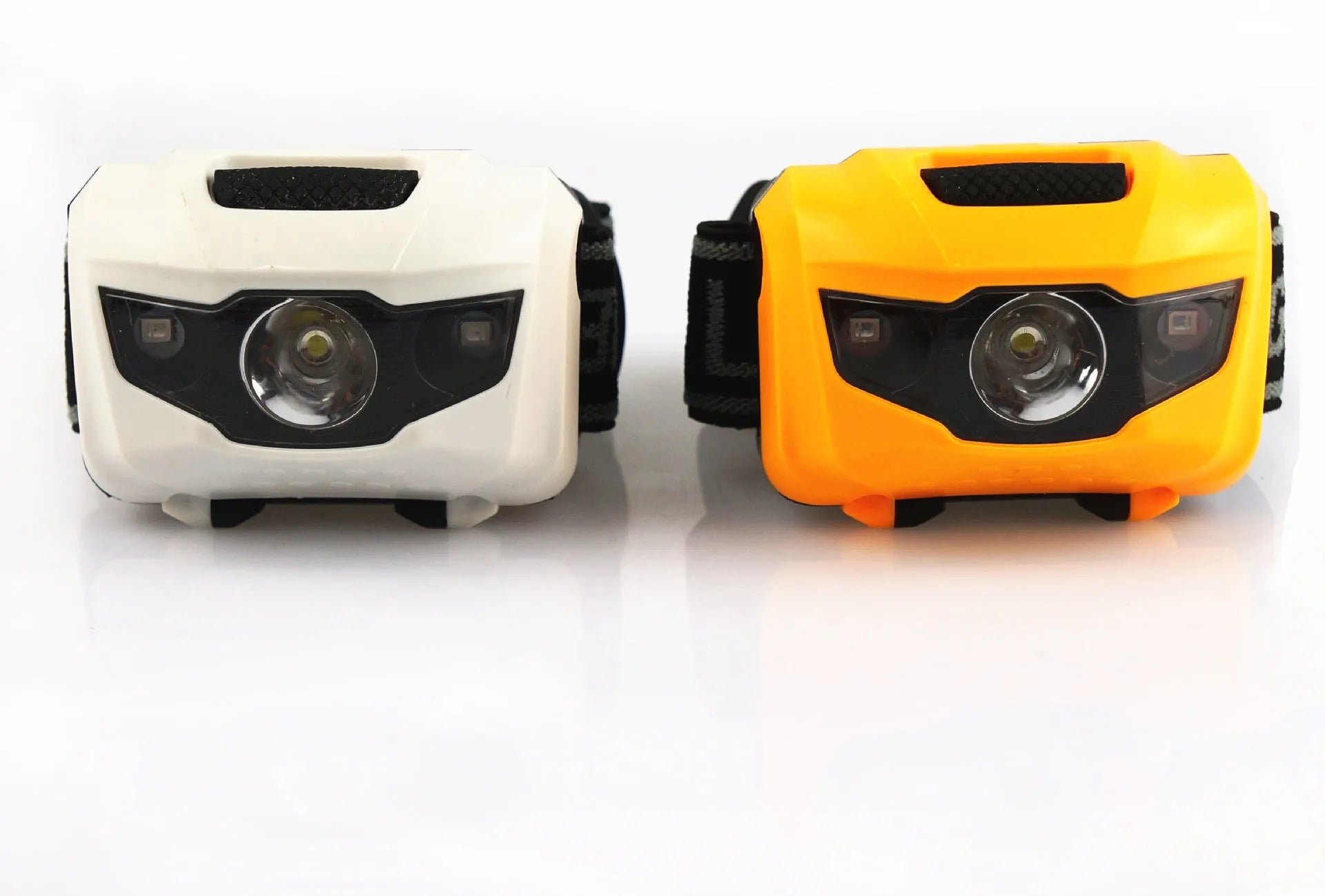 Black waterproof head torch with white and red LEDs, worn on head strap for outdoor activities.