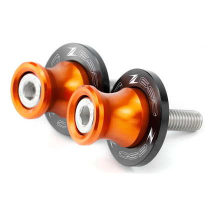 Pair of 8mm CNC aluminium swingarm spools sliders in titanium for Kawasaki Z650 Z900, with Delrin contact and stainless bolts