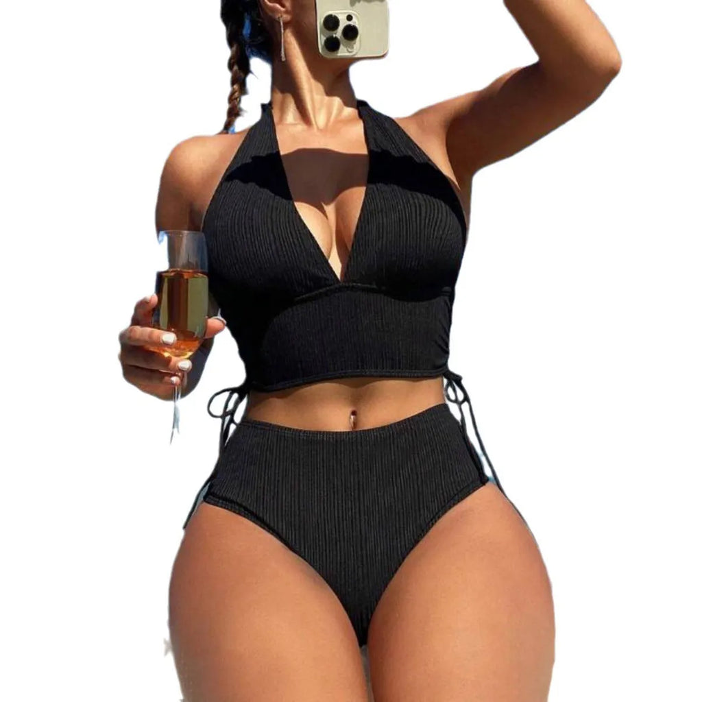 Women's black lace-up halter bikini set with matching briefs on white background