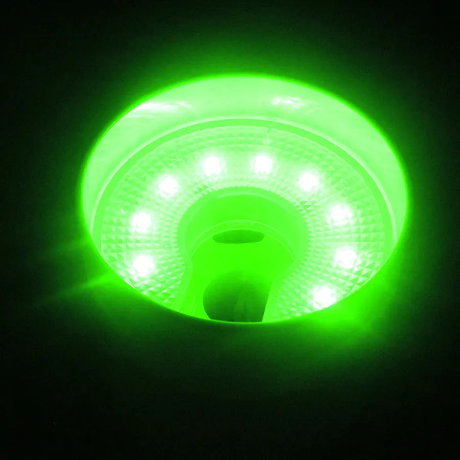 LED ball hole light with transparent shell and screwdriver on golf hole