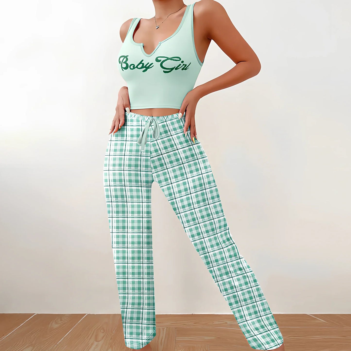 Women's plaid pyjama set with sleeveless letter print top and coordinating trousers for versatile homewear