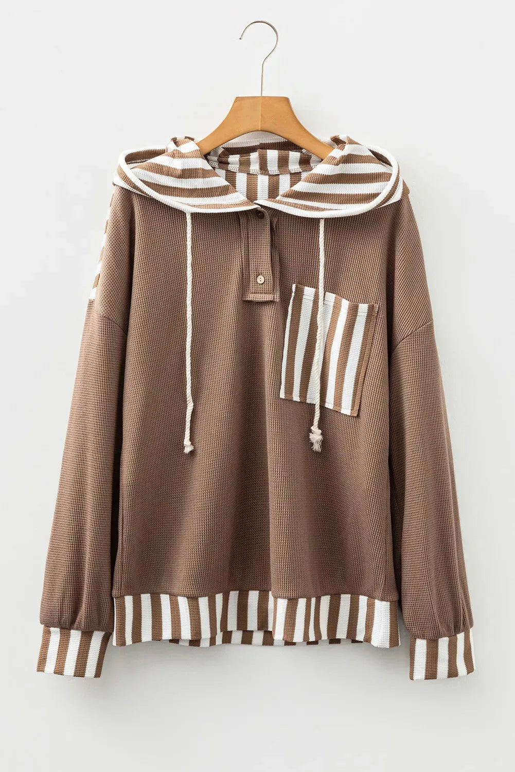 Straw yellow waffle texture hoodie with striped patchwork and a button-front drawstring neckline.