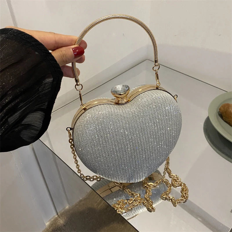 Heart-shaped shiny metal clutch bag with chain strap in various colours