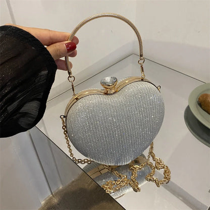 Heart-shaped shiny metal clutch bag with chain strap in various colours