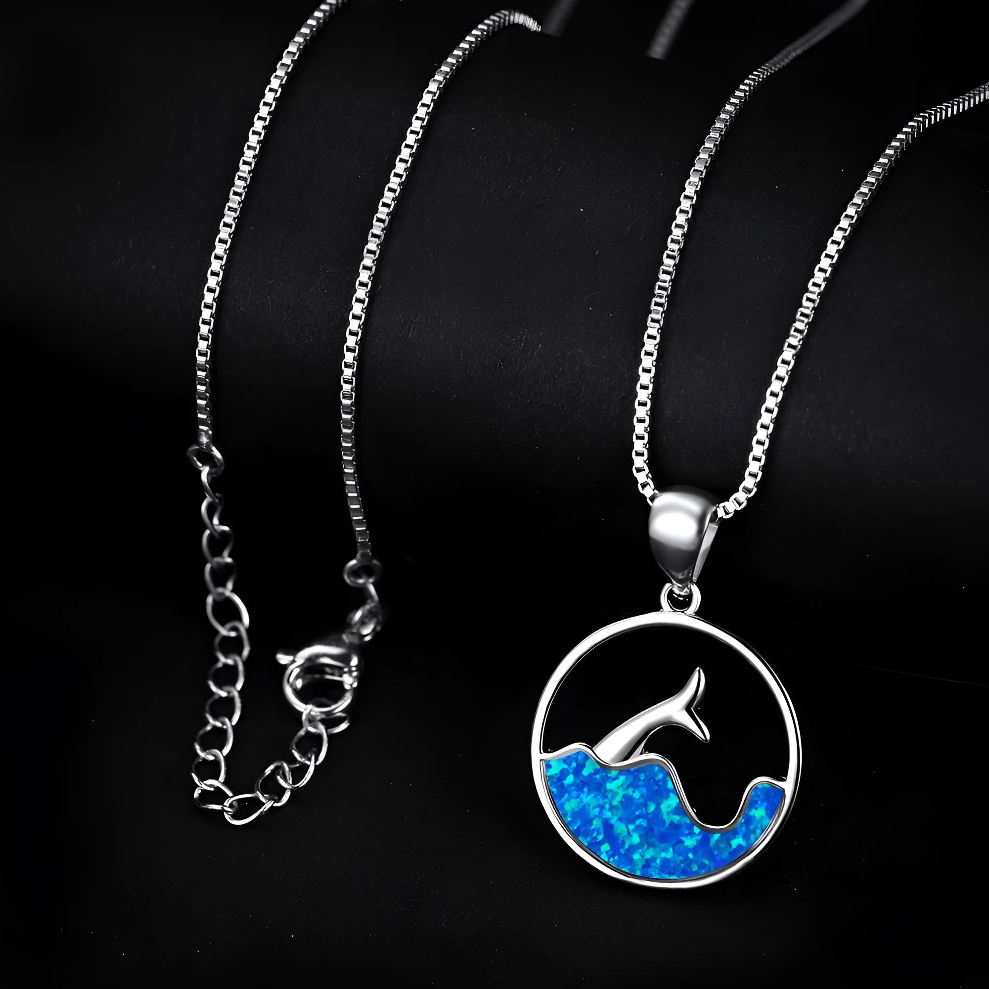 White gold electroplated necklace with geometric sea fishtail pendant featuring round blue opal stone