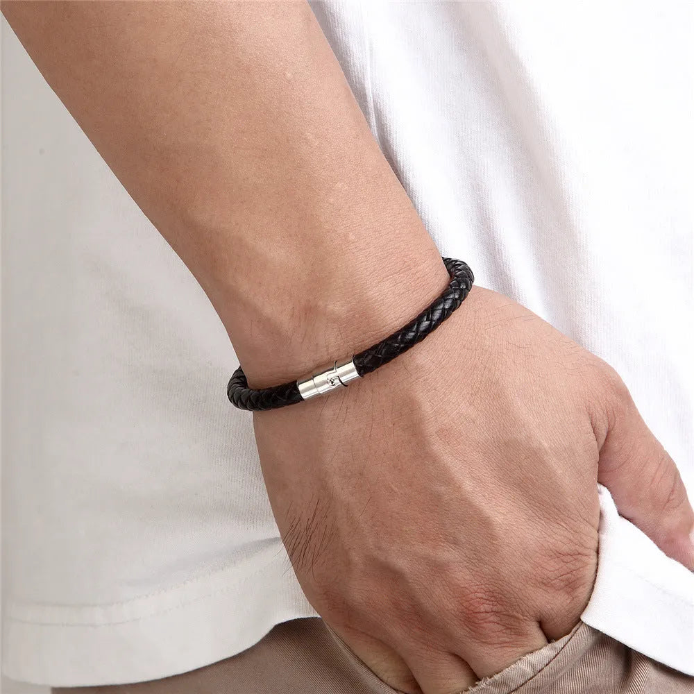 Titanium steel geometric wire bracelet with a magnetic clasp shown in one of four colour options.