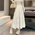 Women's milky white corduroy A-line midi skirt with an elastic waistband, laid flat.
