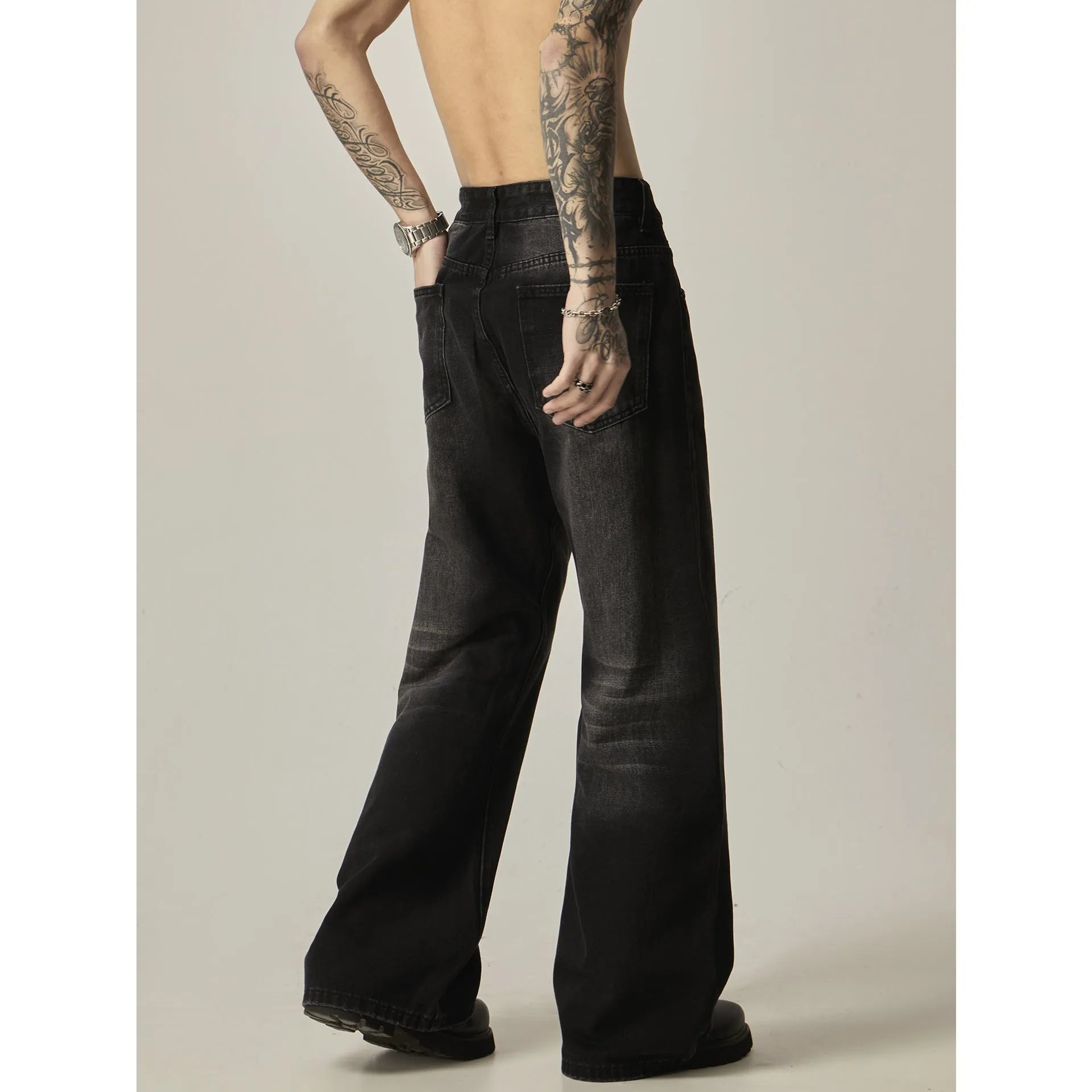 Black loose straight leg jeans with retro American styling and zipper fly