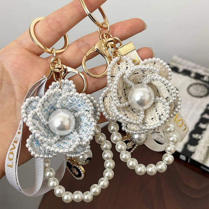 Camellia key chain with ribbon and pearl accent in Korean style, available in four colours