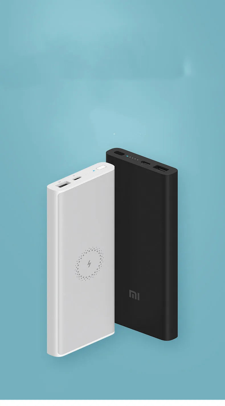 White or black 10000mAh power bank with USB port and wireless charging for tablets and phones.