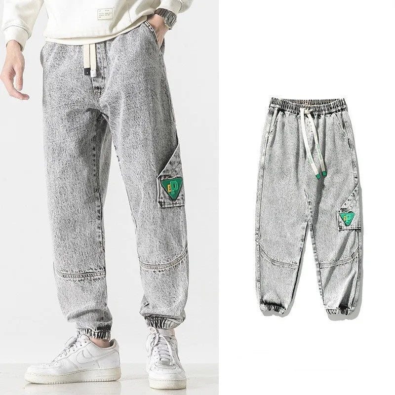 Men's loose-fit tapered cotton trousers in black, blue, or grey colours with mid waist design