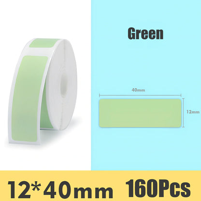 Pack of white D11 waterproof thermal label paper, 12x40mm size, showing clear printed text on resistant surface