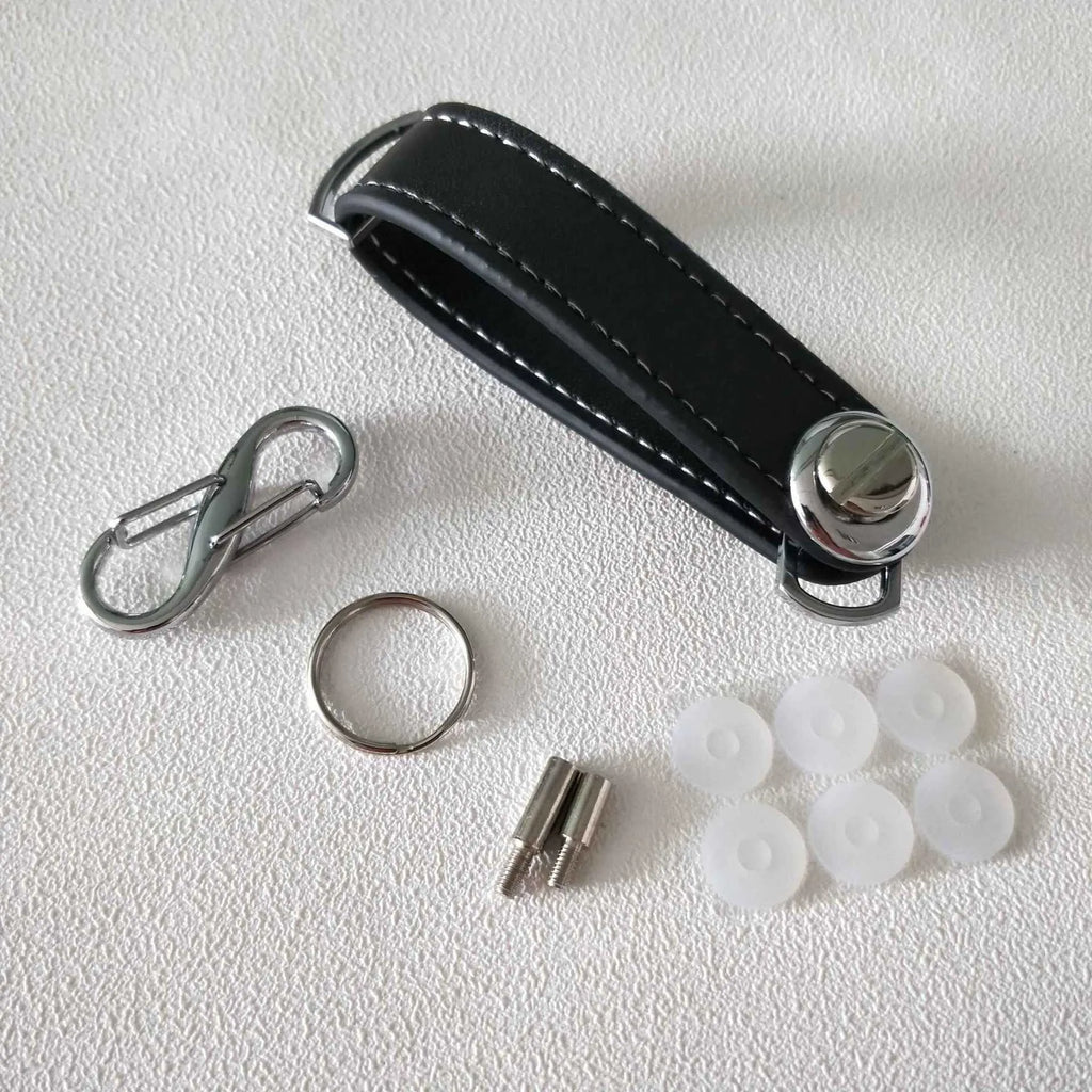 Creative folding key holder in metal copper chrome and cowhide, showing two keyposts and non-slip silicone pad, 85mm length