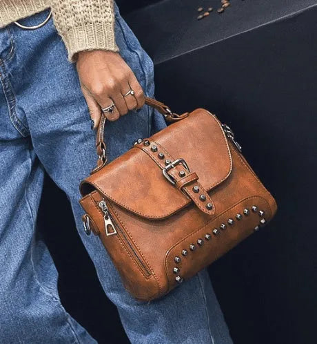 Vintage leather crossbody handbag with flap pocket and rivet detail in brown, size 25x20x12cm