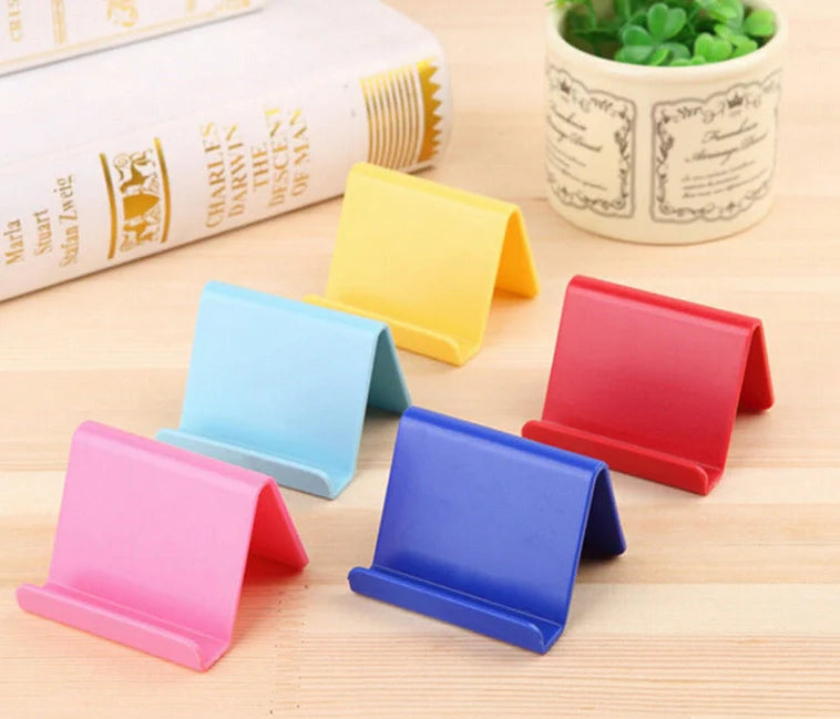 Candy colour plastic phone holder showing 6cm width and 4.5cm height dimensions