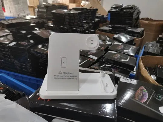 Black folding 4-in-1 wireless charger showing vertical stand for iPhone and flat charging pad.
