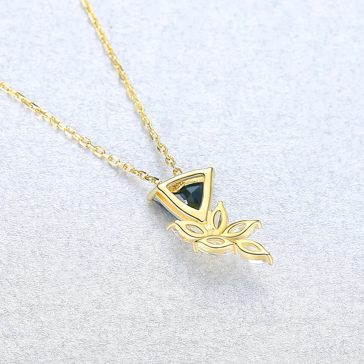 S925 sterling silver floral micro pendant necklace on display showing blue and platinum plating option