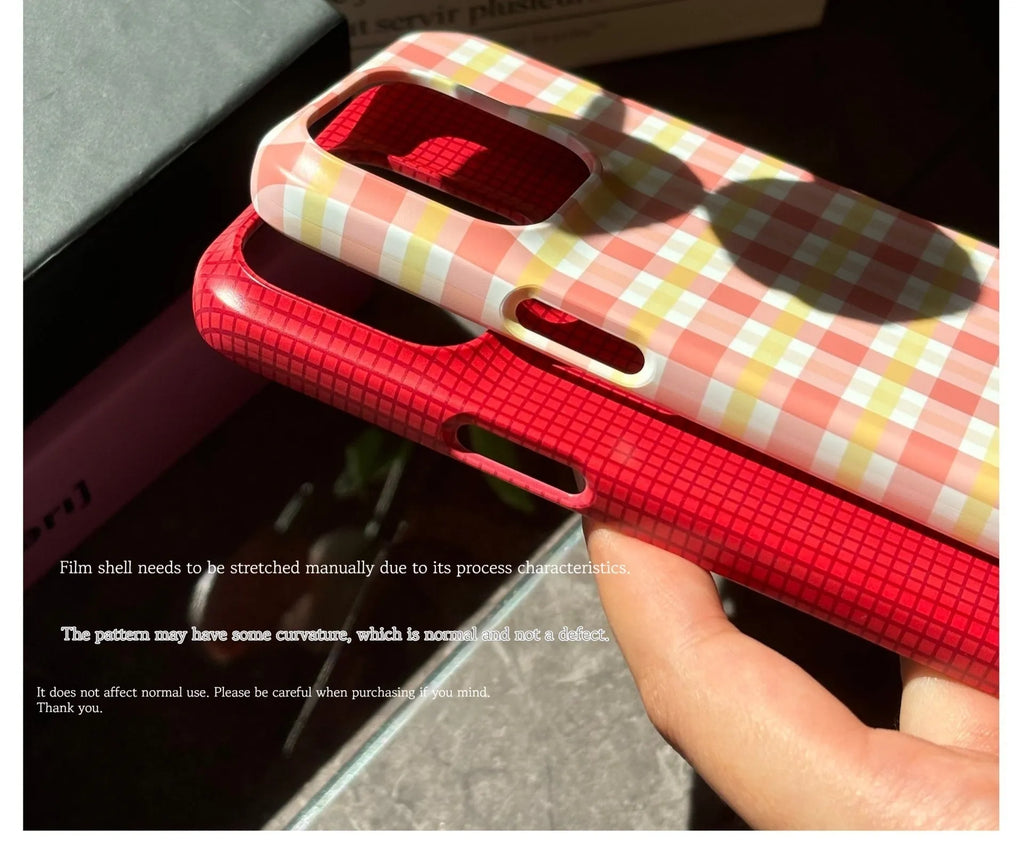 iPhone 15 Pro Max phone case with red plaid design and anti-fingerprint finish.