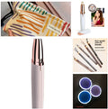 Gold-plated eyebrow epilator trimmer pen with LED light on white background