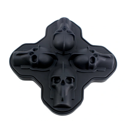 Black silicone ice cube tray with four skull-shaped cavities measuring 12cm long