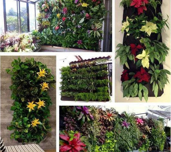Vertical felt wall hanging planter with multiple planting pockets filled with green herbs.