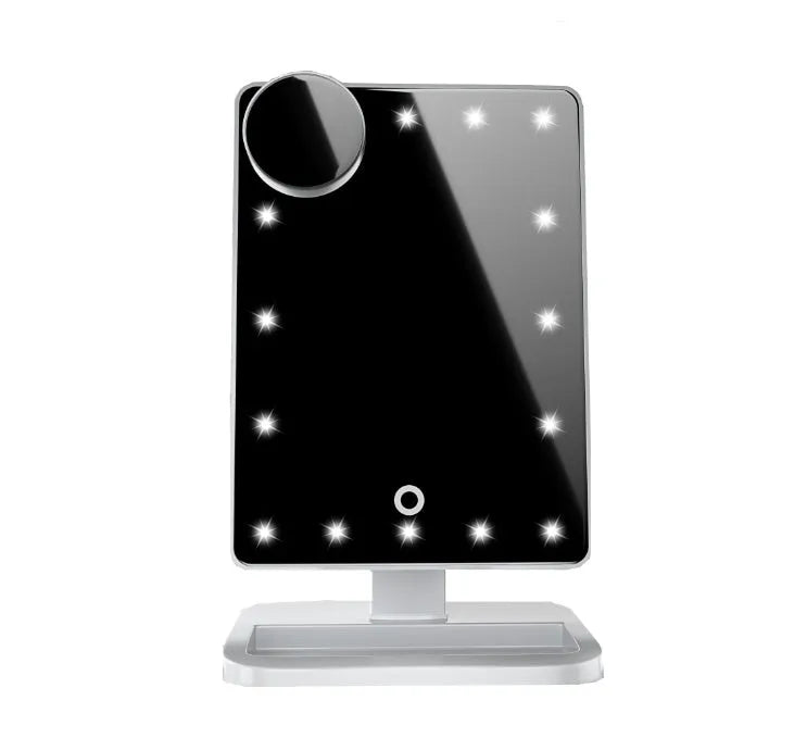 Pink and white touch screen LED makeup mirror with Bluetooth speaker and magnifying glass on a table.
