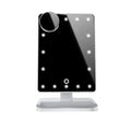 Pink and white touch screen LED makeup mirror with Bluetooth speaker and magnifying glass on a table.