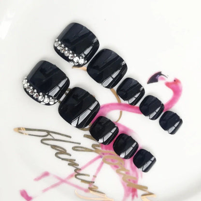 Black rhinestone toe nail patches with geometric and floral designs on adhesive backing