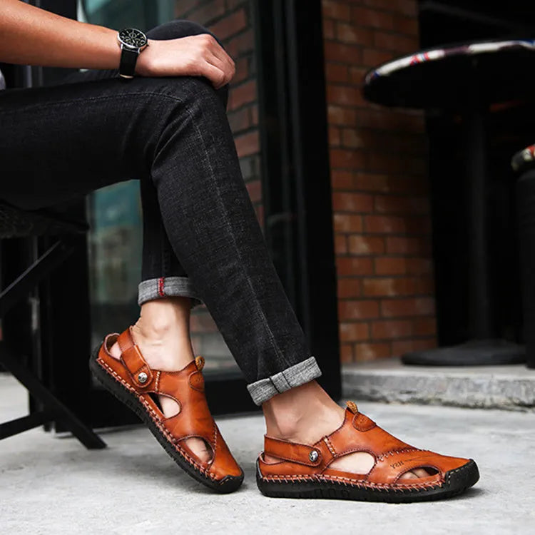 Men's closed toe sandals in black with rubber sole and adjustable slide strap