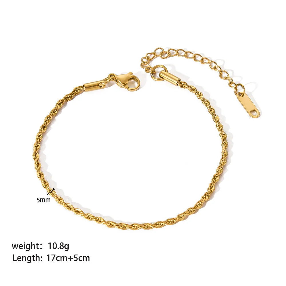 Stainless steel ornament bracelet with real gold treatment in various colours