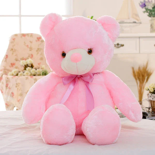 Colorful light-up plush teddy bear with over 7 changing LED colors, a cozy and unique Christmas gift for kids