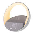 Beige or grey multifunctional desk unit with wireless charging pad, speaker grille, digital clock display, and LED light panel
