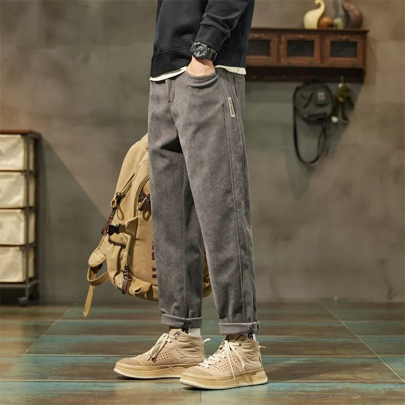 Men's corduroy casual trousers in tapered straight-leg style with mid waist and zip fly
