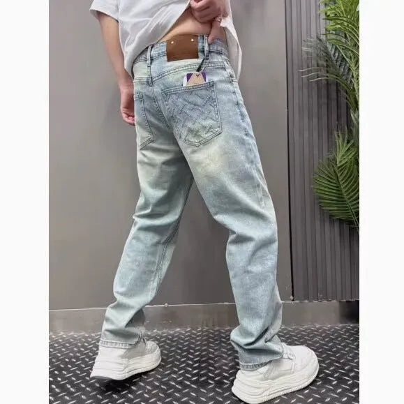 Light blue straight slim denim trousers for teenagers with mid-rise waist and zipper fly closure