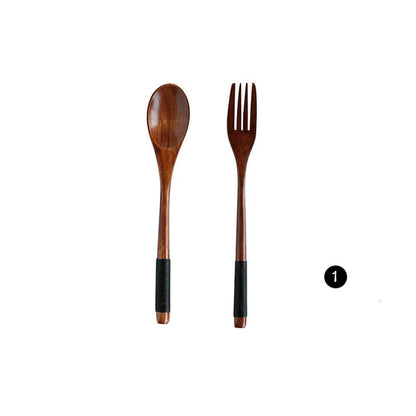 Japanese-style wooden bamboo spoon and fork set on a wooden table