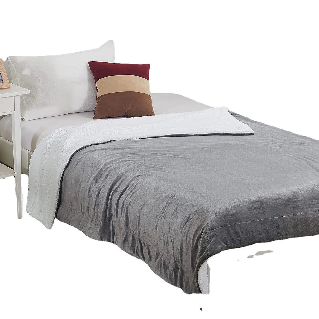 Grey and white USB electric heating blanket with intelligent temperature control, shown on a sofa.