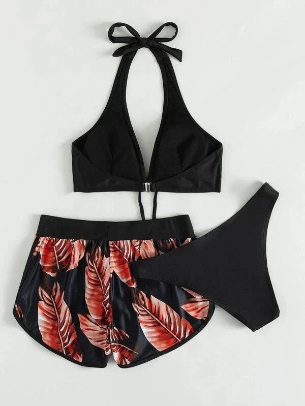 Chic leaf-patterned women's swimsuit set with bikini top, bottoms, and matching shorts in various vibrant colors