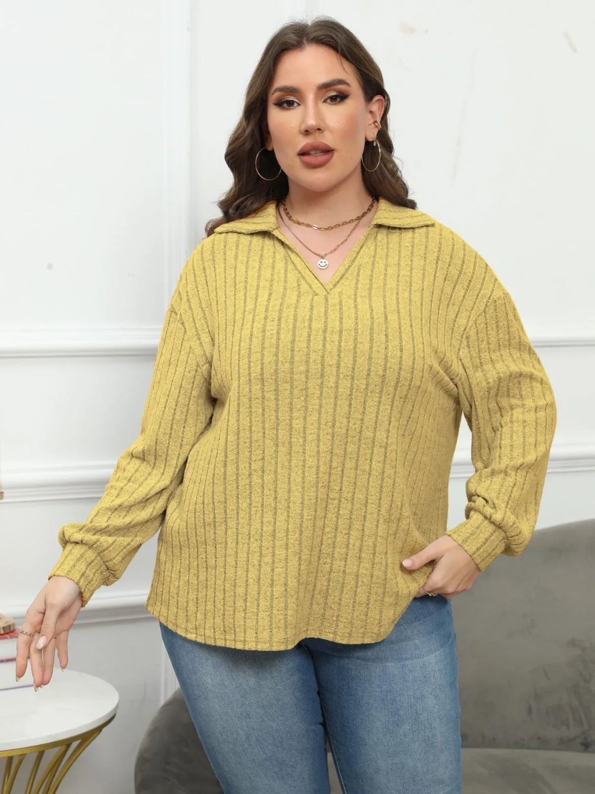 Women's plus size grey polo collar fleece pullover shirt with full lantern sleeves.