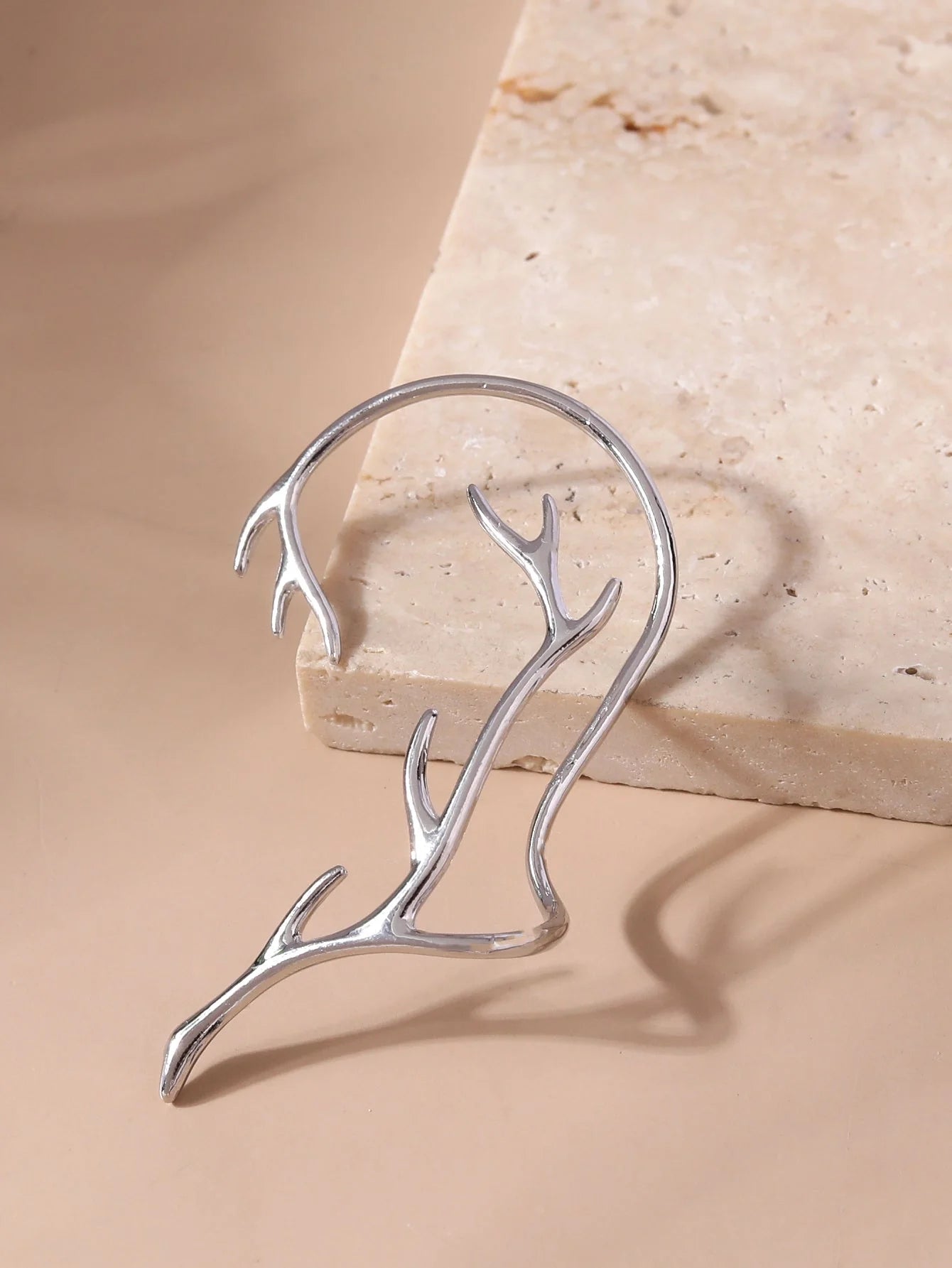 Vintage bone hypoallergenic elf earrings in gold, silver, black, and green with geometric design