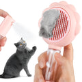 Grey spray cat brush with release button next to a cat, showing curved stainless steel bristles.