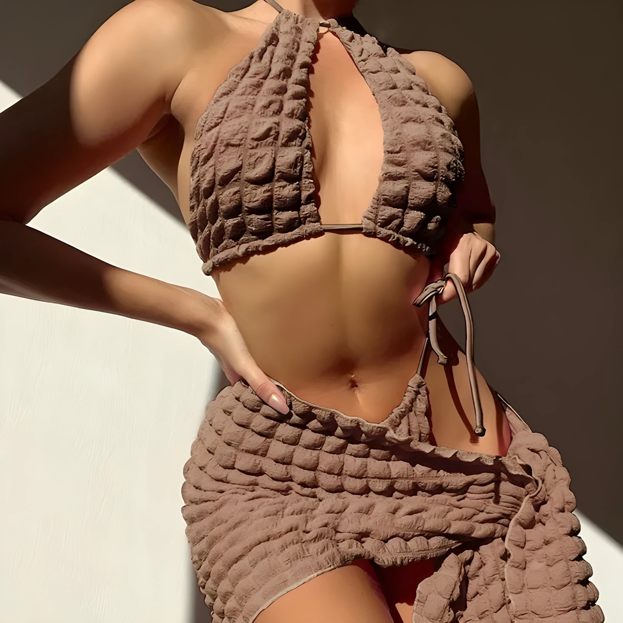 Brown seersucker women's lace-up three-piece bikini swimsuit set on a white background.
