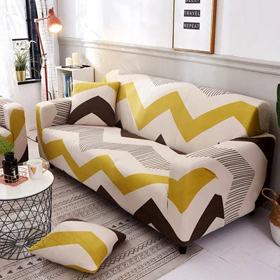 Printed stretchable sofa slipcover covering a three-seater sofa in a modern geometric pattern