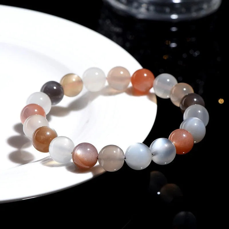 Natural colourful moonlight moonstone duobao bracelet with 8mm beads on a wrist.