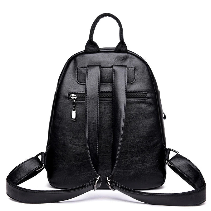 Stylish PU backpack in black, red, and blue colours with a sleek, square silhouette and multiple interior compartments