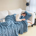 Soft Wind bubble velvet faux rabbit fur blanket in blue showing double-sided thickening construction